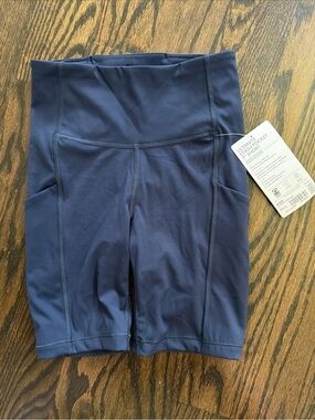 NWT ATHLETA WOMENS NAVY ULTIMATE STASH POCKET 7" SHORTS YOGA BIKE HIGH WAIST XXS